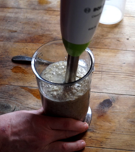Blending the oats with a hand blender