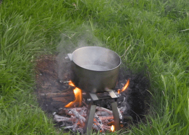 an animated image of the stick fire grate in use