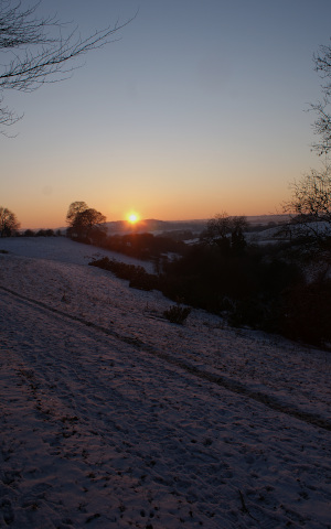 Landscape image, ‘Snowy sunset on Long Hill from Castle Bank Enclosure’, February 2012