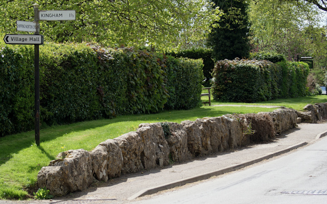 The ancient standing stone kerbs around Churchill Churchyard