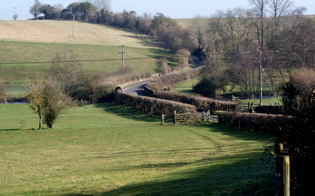 Landscape image, ‘The modern road dog-legs on the crossing of the River Glyme