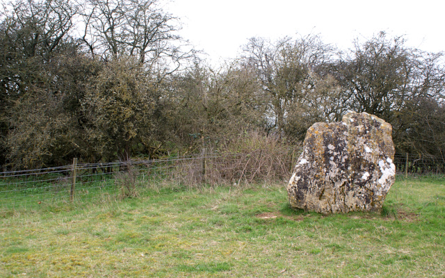 Landscape image, ‘Lyneham Long Barrow portal stone and remains of the barrow mound behind’